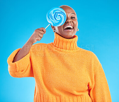 Buy stock photo Funny, lollipop and portrait of black woman with candy in studio isolated on a blue background. African person, happy face and sweets, dessert and treats, sugar food and eating, laughing and hungry
