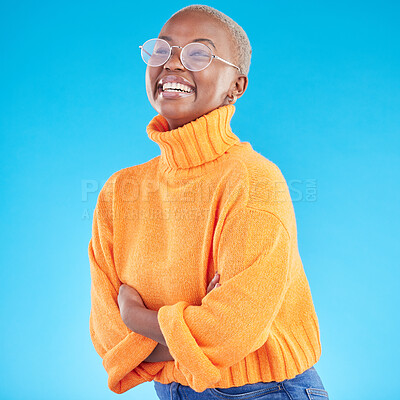 Buy stock photo Thinking, happy and black woman with glasses, arms crossed and studio isolated on a blue background. Excited, confident nerd and African geek smile for fashion, style and person in casual clothes