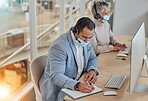 Face mask, call centre and customer service people with computer and writing notes or information. A man and woman telemarketing consultant with ppe for networking, help desk or sales account details