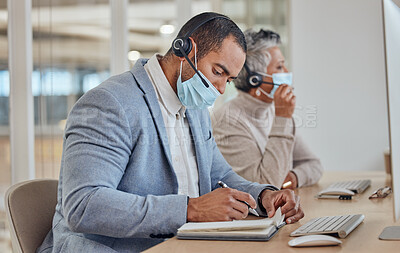 Buy stock photo Call center, face mask and writing with business man in office for communication, consulting or advice. Healthcare, virus and bacteria with employee in agency for communication, help desk and hygiene