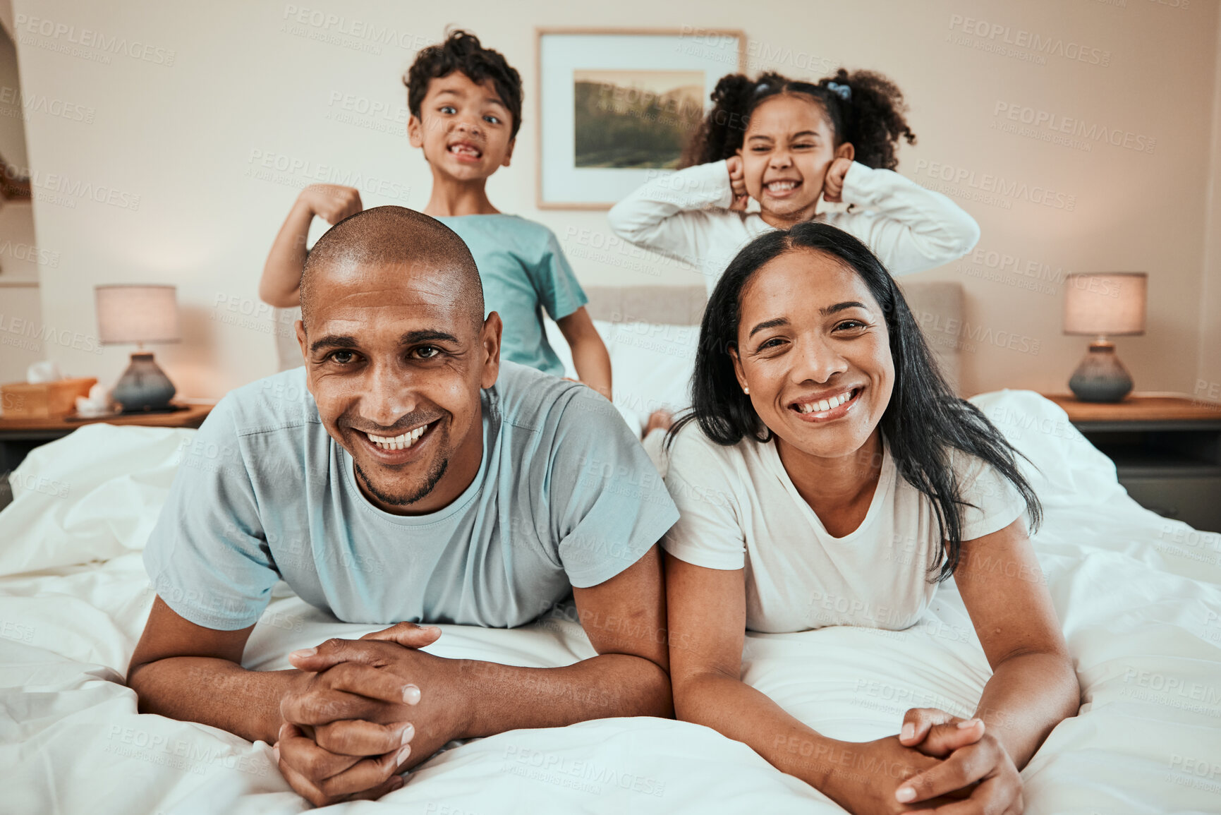 Buy stock photo Happy family, portrait and bonding in bed, having fun and playing in their home together. Face, smile and children with goofy, expression and parents in a bedroom playful, games and enjoying weekend