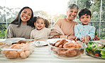 Happy, food and relax with portrait of family in dining room for lunch, smile and holiday celebration Thanksgiving, party and dinner with people at table in home for nutrition, happiness and love