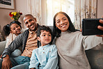 Family, selfie and children with parents on sofa for social media, online memory and happy together at home. Interracial people, kids with mother and father smile in profile picture or photography