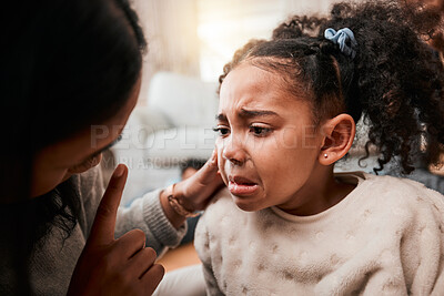 Buy stock photo Discipline, angry and mother with girl, home and unhappy with expression, crying and naughty. Serious, female child and mama with conflict, sad and conversation with reprimand, punish kid and advice