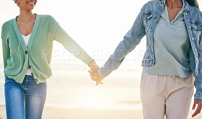 Buy stock photo Love, beach and lesbian couple on holding hands on sunset holiday adventure, date or quality time together. Lgbt women, bonding and relax on ocean vacation with romance, pride and happy in nature.