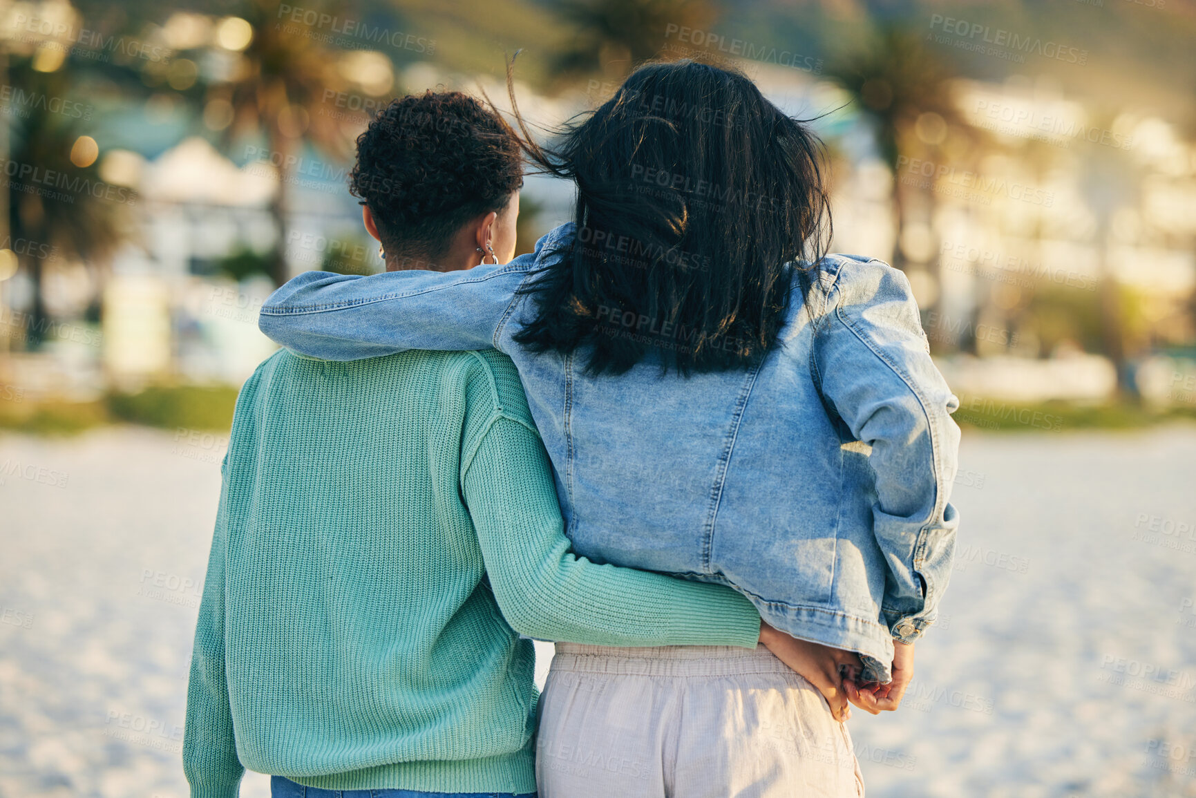 Buy stock photo Beach, lesbian or back of gay couple walking with love, care and pride in LGBTQ community with support. Hugging, queer women or people in nature on romantic date or commitment on holiday vacation