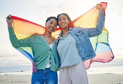 Buy stock photo Woman, lesbian couple and pride flag on beach together in happiness for LGBTQ community or rights. Portrait of proud and confident gay or bisexual women smile on ocean coast in love, support or trust