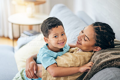 Buy stock photo Portrait, hug and boy child with mother on a sofa happy, bond and relax in their home together. Love, smile and kid with mom in living room embrace, chilling and enjoying family time and relationship