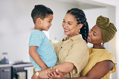 Buy stock photo LGBT, kid and happy couple hug, care and smile for home bonding, child support and enjoy quality time together. Family, hugging and gay people, queer mothers or lesbian women connect with adopted son
