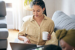 Relax, coffee and a woman with a laptop on the sofa for movies, internet connection or online news. House, email and a young girl with tea and a computer on the couch and reading a notification