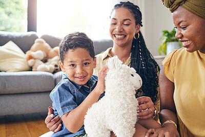 Buy stock photo Portrait, gay family and child with a teddy bear on a home floor for development, fun and smile. Adoption, lesbian or LGBT women or parents and kid together in a lounge while playing with toys