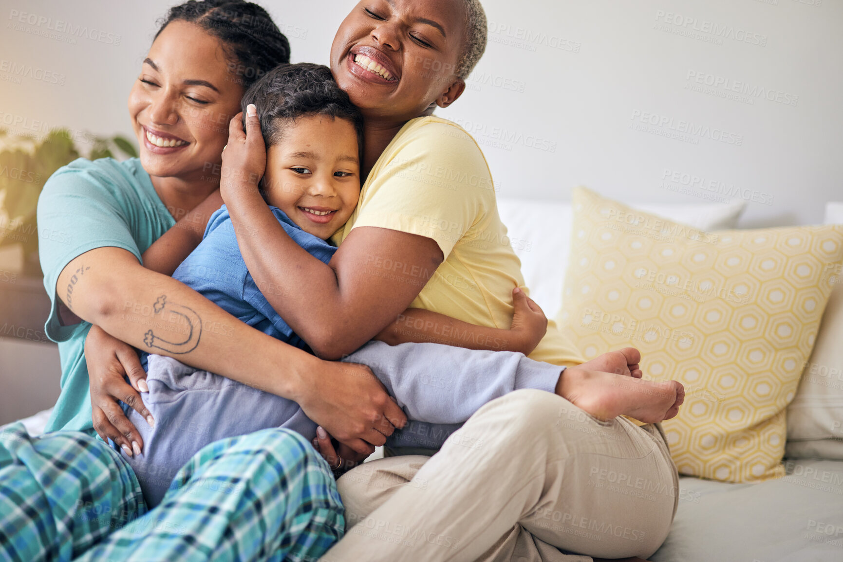 Buy stock photo LGBT, bedroom hug and happy family, child and relax mothers bonding, support and enjoy quality time together. Home, care and gay people, homosexual parents or lesbian women embrace young kid on bed