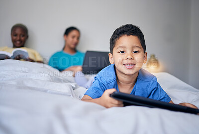 Buy stock photo Kid, tablet and smile portrait in bed at family home in the morning with parents feeling relax in living room. Bedroom, education app and house with a young child online with mother and kids website