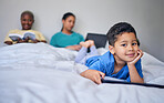 Kid, tablet and happy portrait in bed at family home in the morning with parents feeling relax in living room. Bedroom, education app and house with a young child online with mother and kids website