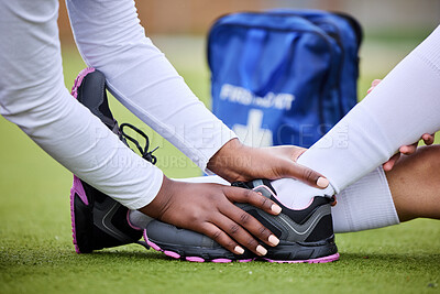 Buy stock photo Hands, ankle injury and field for sports, help and first aid with medical staff, support and care on ground. People, athlete and coach with nursing, emergency or accident on grass for healthcare