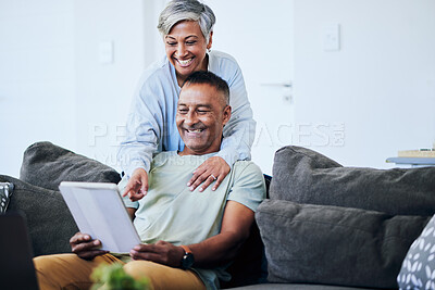 Buy stock photo Senior couple, tablet and point on sofa with smile, comic laugh or watch funny video on internet in home. Mature man, elderly woman and digital touchscreen with choice, shopping or social network app