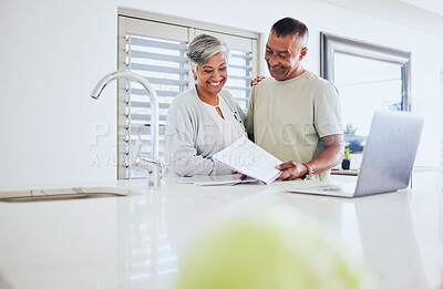 Buy stock photo Happy senior couple, paperwork and laptop for finance, budget or planning expenses together at home. Elderly man and woman smile in happiness on computer for financial documents, bills or mortgage