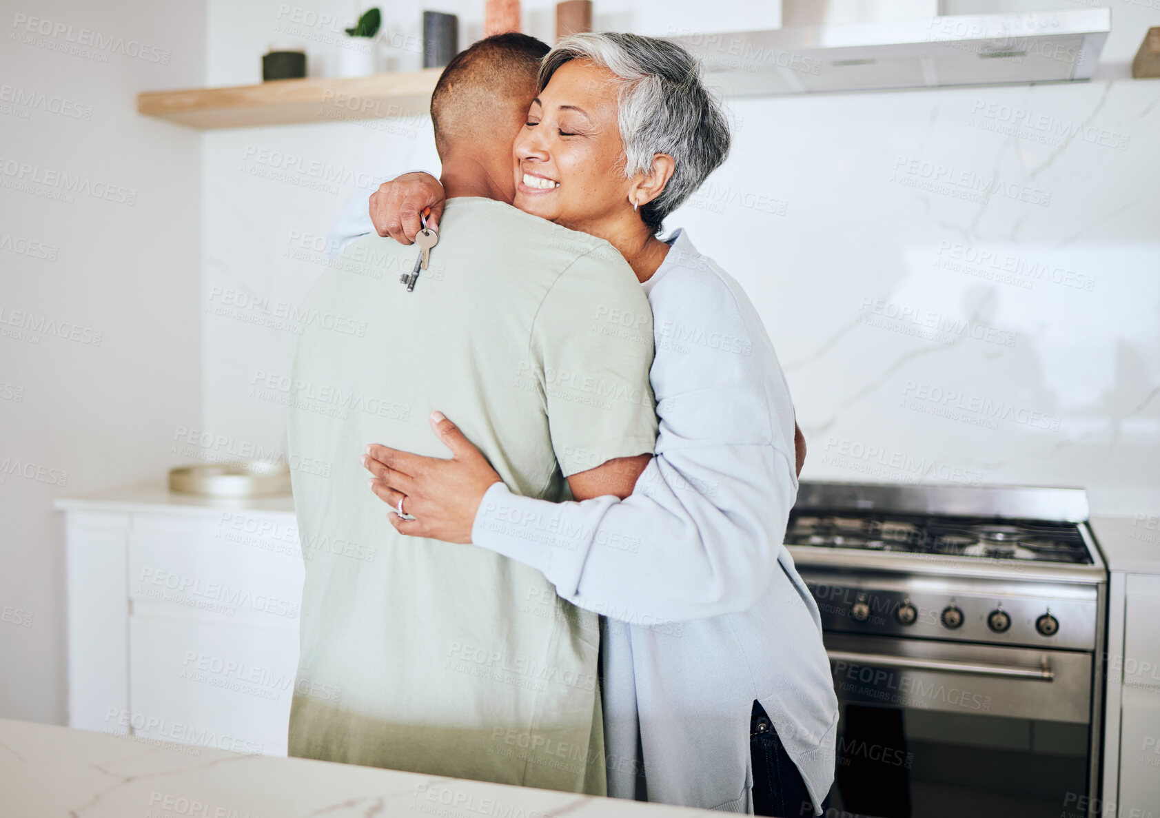Buy stock photo Senior couple, new home and hug with key, smile and start life together with property investment for retirement. Happy elderly woman, man and embrace for real estate, house or apartment with goal