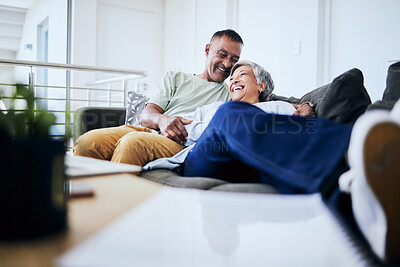 Buy stock photo Smile, home and senior couple on couch, love and retirement with marriage, laughing and relax. Old man, funny and mature woman on a sofa, conversation and romance with discussion, care and happiness