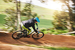 Mountain bike, man and motion blur in forest for competition, speed or off road adventure on path. Fast athlete, sports and bicycle for contest, cardio race and power in nature, park or action trail 