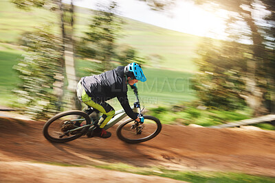 Buy stock photo Mountain bike, man and motion blur in forest for competition, speed or off road adventure on path. Fast athlete, sports and bicycle for contest, cardio race and power in nature, park or action trail 