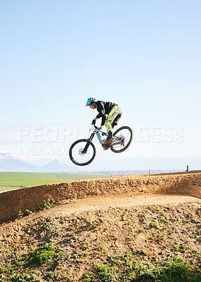 Buy stock photo Cycling, sports and man in air on bicycle for adrenaline on adventure, freedom and jump for speed. Mountain bike, tricks and cyclist for training, exercise and fitness on dirt road, trail or track