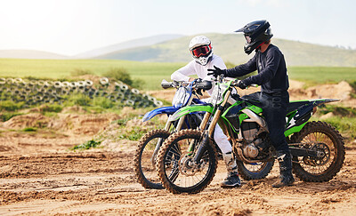 Buy stock photo Sports, friends and men with motorcycle in countryside for fun, hobby and stunt training, practice or freedom. Off road on dirt, motorbike and biker people in nature for adrenaline, challenge or race