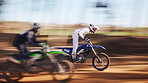 Race, motorcycle and sports, men in speed for practice, training and fast action adventure. Professional dirt road biking, motion and biker in motorbike competition, performance and outdoor challenge