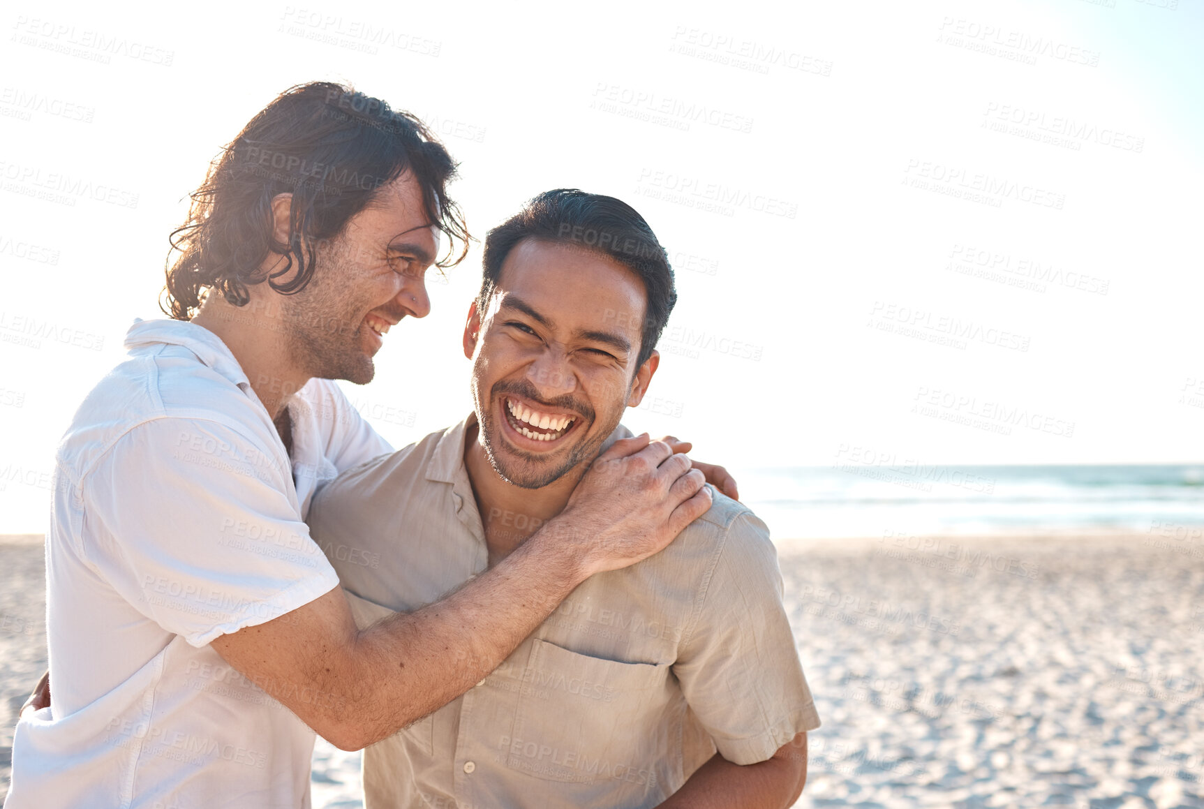 Buy stock photo Love, smile and gay men on beach, hug and laugh on summer vacation together in Thailand. Sunshine, ocean and mockup, happy lgbt couple embrace in nature for on fun holiday with pride, sea and sand.