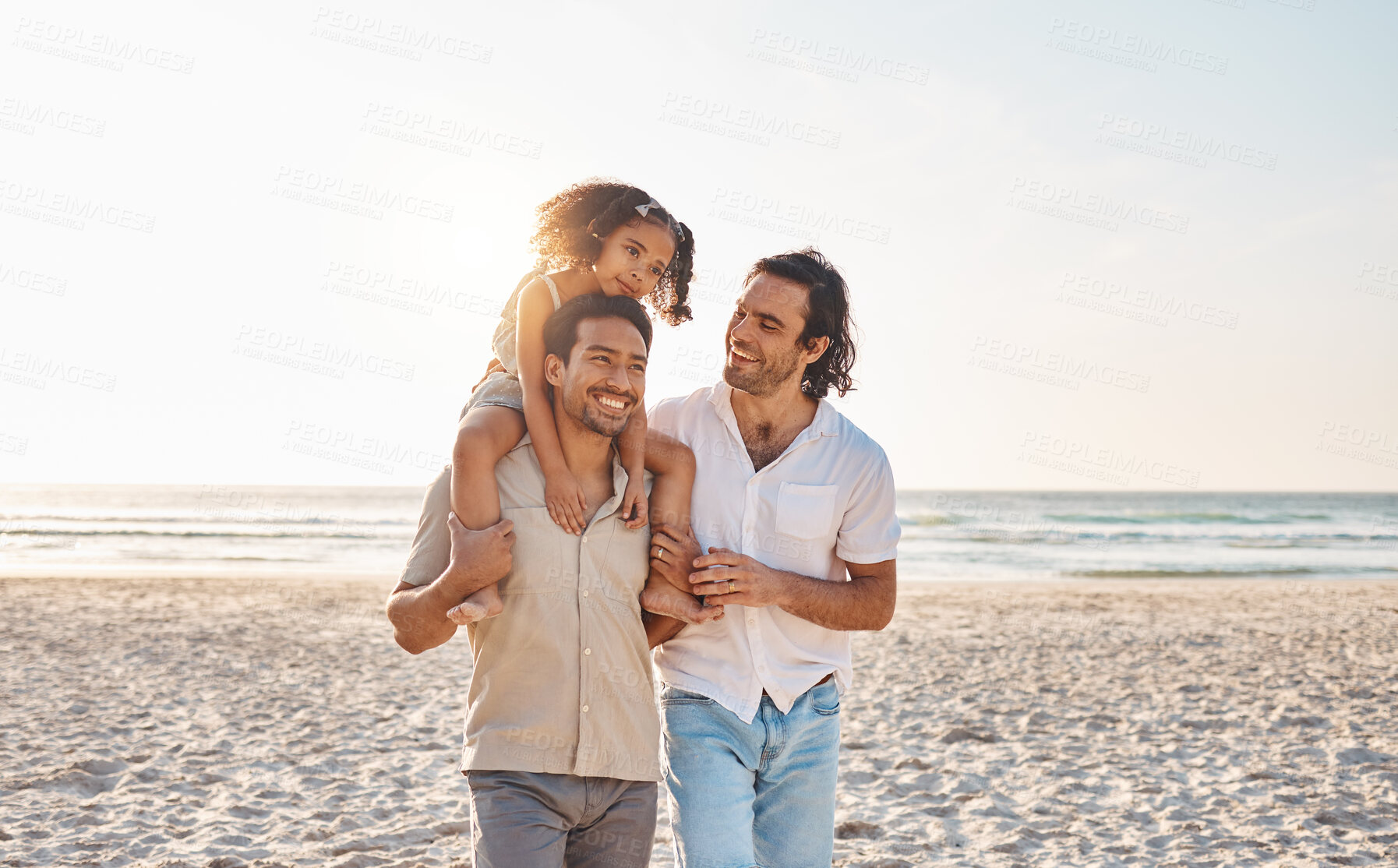 Buy stock photo Gay couple, piggyback and relax with family at beach for seaside holiday, support and travel mockup. Summer, vacation and love with men and child in nature for lgbtq, happiness and bonding together