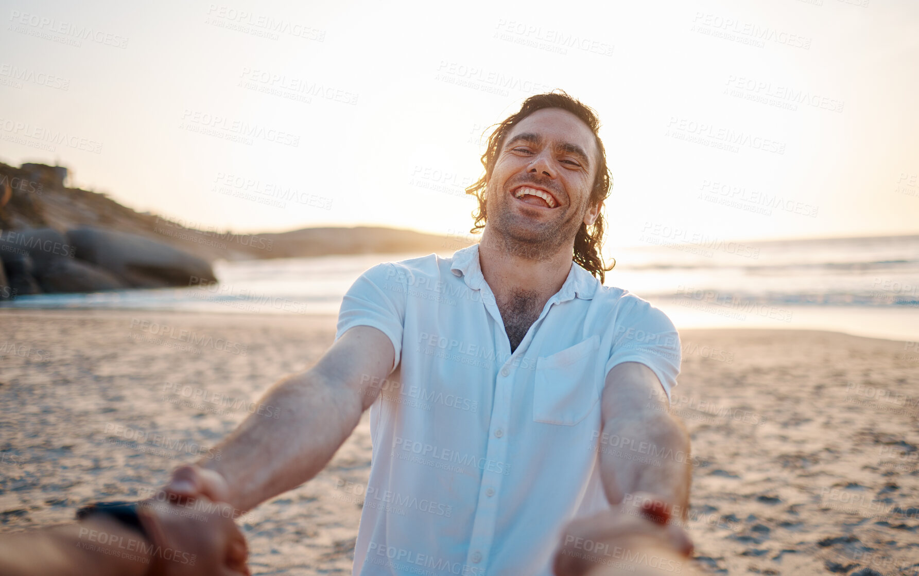 Buy stock photo Man, holding hands and beach with pov, smile and excited for love, romance and freedom in sunset by ocean. Couple, together and comic laugh on sand, sea and waves for vacation, holiday or honeymoon