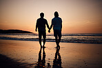 Silhouette, holding hands and gay men on beach, sunset and shadow on summer vacation together in Thailand. Sunshine, ocean and romance, lgbt couple in nature and fun holiday with pride, sea and sand.