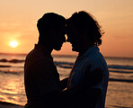 Silhouette, sunset and gay men on beach, love and shadow on summer island vacation together in Thailand. Sunshine, ocean and romance, lgbt couple in nature and fun holiday with pride, sea and waves.