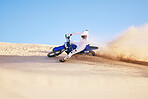 Bike, sand and sports with a man in the desert for adrenaline, adventure or training in nature. Moto, exercise and dust with a male athlete moving on dunes for freedom, energy or balance in summer