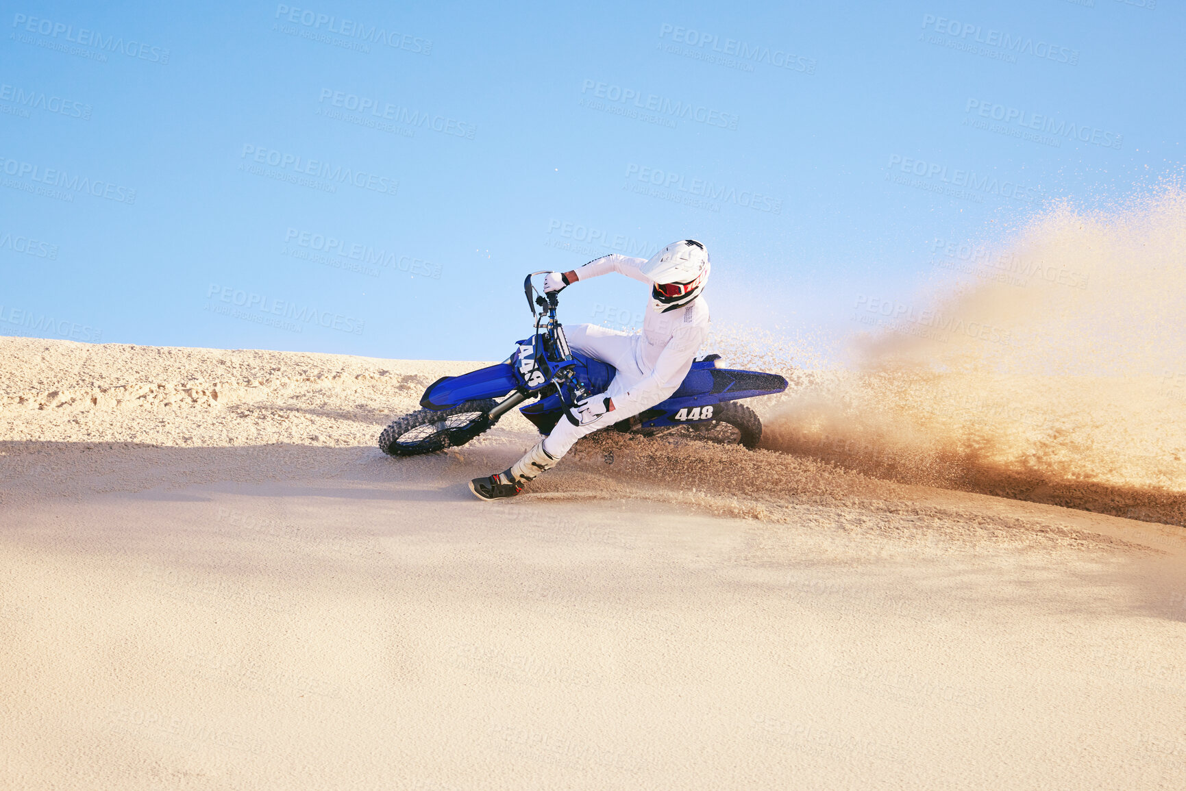 Buy stock photo Bike, sand and sports with a man in the desert for adrenaline, adventure or training in nature. Moto, exercise and dust with a male athlete moving on dunes for freedom, energy or balance in summer