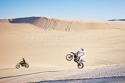 Buy stock photo Bike, sand and freedom with people in the desert for adrenaline, adventure or training in nature. Moto, sports and balance with friends on dirt in summer for a race competition or training on space