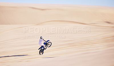 Buy stock photo Bike, sand and fitness with a man in the desert for adrenaline, adventure or training in nature. Motorcycle, speed and balance with an athlete riding a sports vehicle on space in summer for freedom