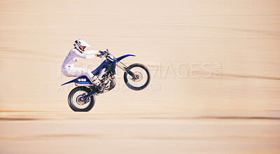 Buy stock photo Race, motorbike stunt and person in desert, action and extreme sport, speed riding outdoor and mockup space. Adventure, fitness and train, motorcycle exercise and freedom, challenge and performance
