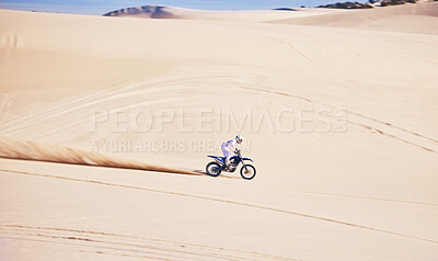 Buy stock photo Bike, sports and speed with a man in the desert for a fitness, freedom or an adrenaline hobby. Motorcycle, training and summer with a male athlete riding a vehicle in Dubai for energy on space