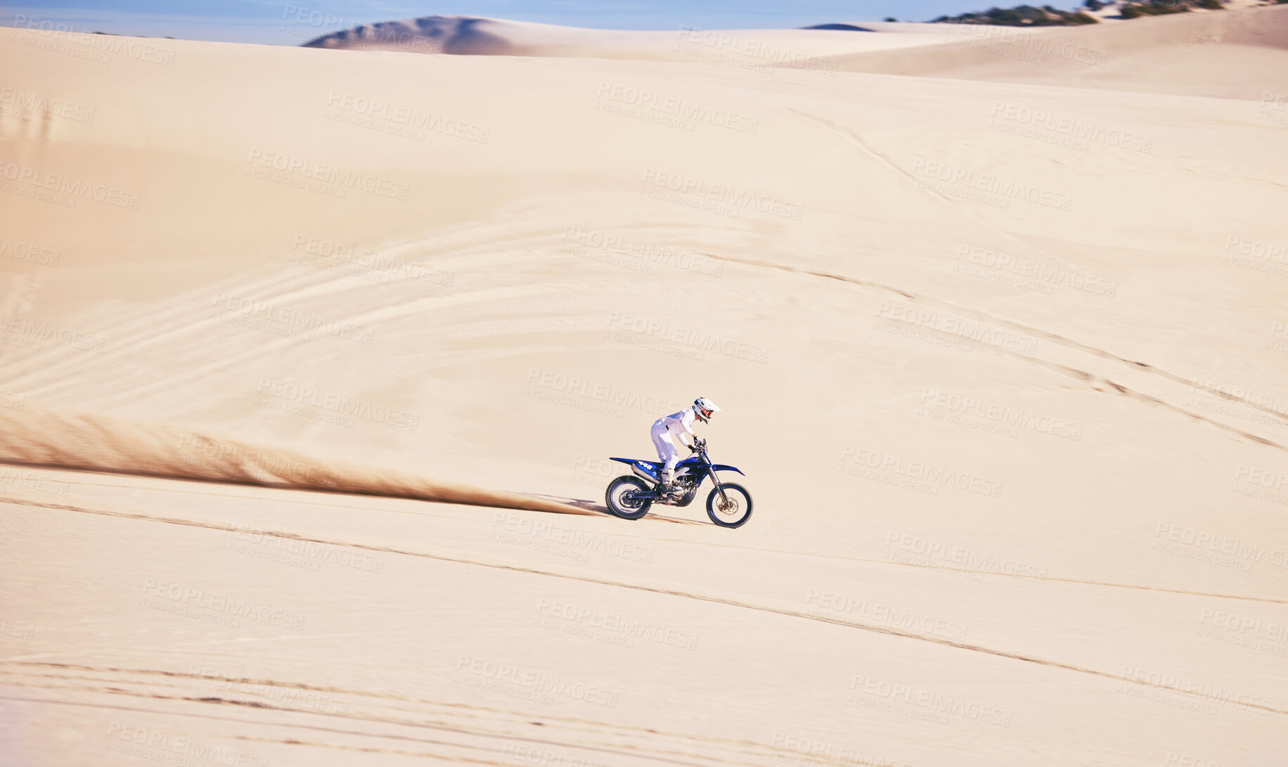 Buy stock photo Bike, sports and speed with a man in the desert for a fitness, freedom or an adrenaline hobby. Motorcycle, training and summer with a male athlete riding a vehicle in Dubai for energy on space
