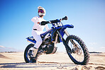 Sand, motor sports and man drive with motorbike for adrenaline, adventure and freedom in desert. Action, extreme sport and male person on bike on dunes for training, exercise and race or challenge