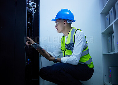 Buy stock photo Man, engineering and tablet for power maintenance, server room or data center inspection in IT cybersecurity. Young, electrician person on digital tech for network programming, electricity and cables