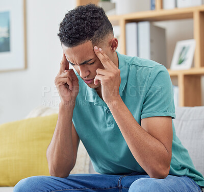 Buy stock photo Stress, home, and man on a couch, headache and burnout with pain, fatigue and mental health. Person, student or guy on a sofa, migraine or exhausted with anxiety, frustrated or depression in a lounge