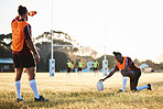 Rugby, focus and sport game with support, exercise and competition with athlete ball training. Field, back and target practice on grass with cardio, fitness and team workout outdoor for teamwork