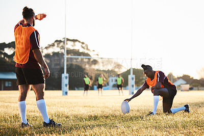 Buy stock photo Rugby, sun and sport game with support, exercise and competition with athlete ball training. Field, back and target practice on grass with cardio, fitness and team workout outdoor for teamwork