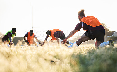 Buy stock photo Rugby, team and group stretching at training for match or competition in the morning doing warm up exercise on grass. Wellness, teamwork and people or players workout together in professional sports