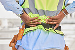 Man, architect and hands in back pain, accident or posture after construction injury on site. Rear view of male person, contractor or engineer with sore spine, muscle or bruise from architecture