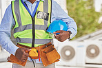 Black man, helmet closeup or engineer on construction site for maintenance and architecture outdoor. Contractor, professional renovation or handyman building urban infrastructure with tools on waist