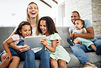 Tablet, laughing and family watching a video or funny, comedy or comic movie together in the living room. Happy, bonding and children streaming a show on digital technology with their parents at home