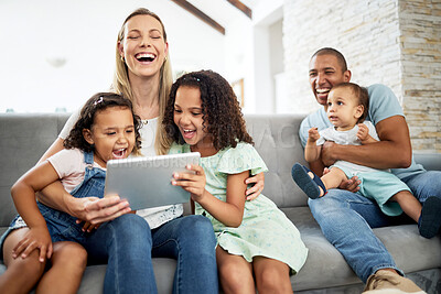 Buy stock photo Tablet, laughing and family watching a video or funny, comedy or comic movie together in the living room. Happy, bonding and children streaming a show on digital technology with their parents at home